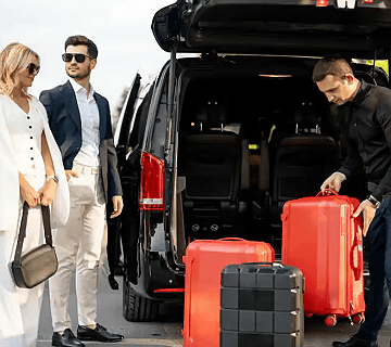 Tailored private service - GEC Transfers chauffeur loading luggage