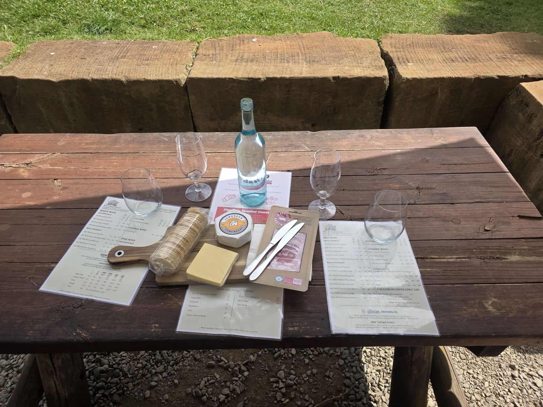 Tasting board with wine glasses and cheese on a GEC wine tour